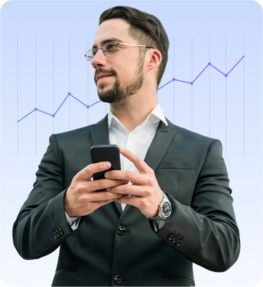 A sharply dressed businessman in a suit holds his smartphone while standing in front of a rising line chart on a blue gradient background, suggesting mobile data analysis.