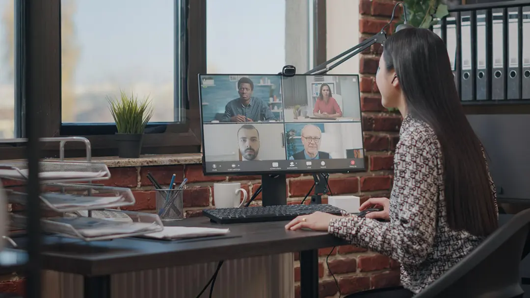 Professional consultant doing a zoom meeting with a client after downloading zoom video communications.