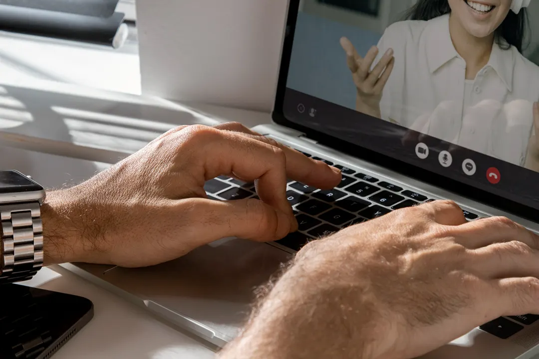 Sales professional running a zoom meeting test because he is facing audio issues during the call.