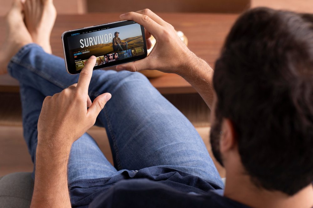 man browsing streaming on mobile device