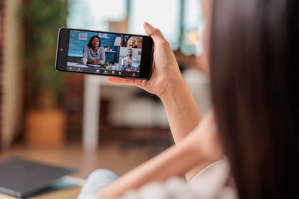 business woman joins work call from phone