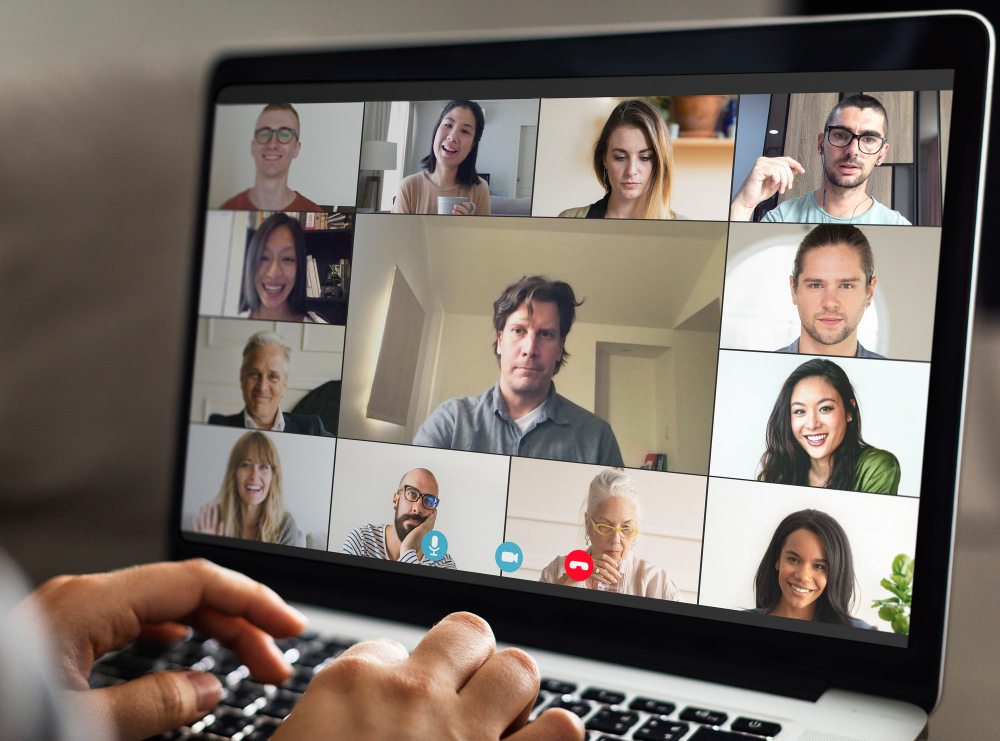 laptop screen with video meeting
