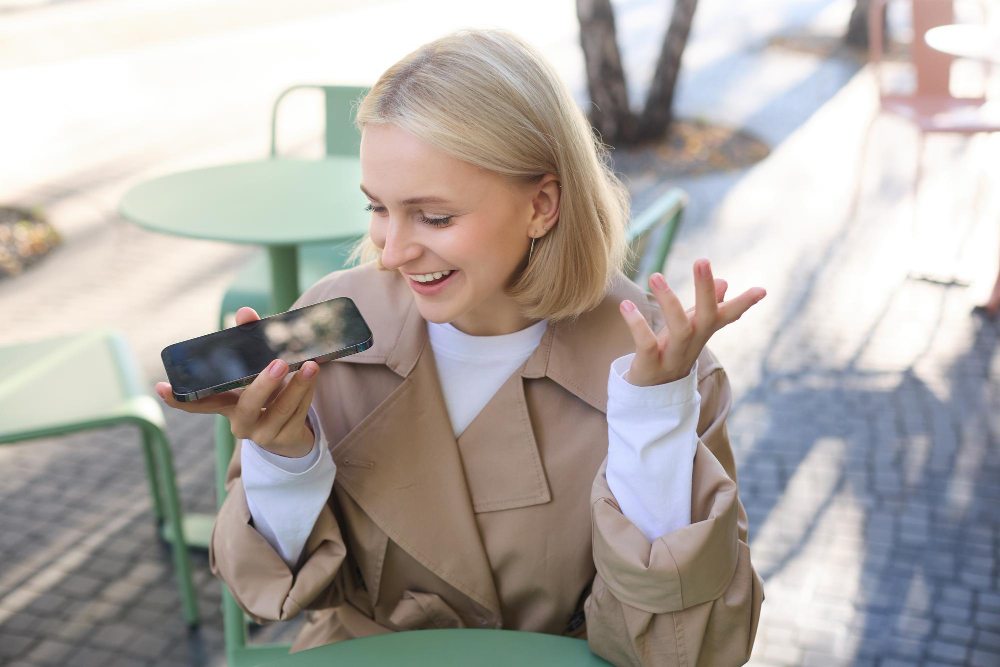 girl recording voice memo on iphone