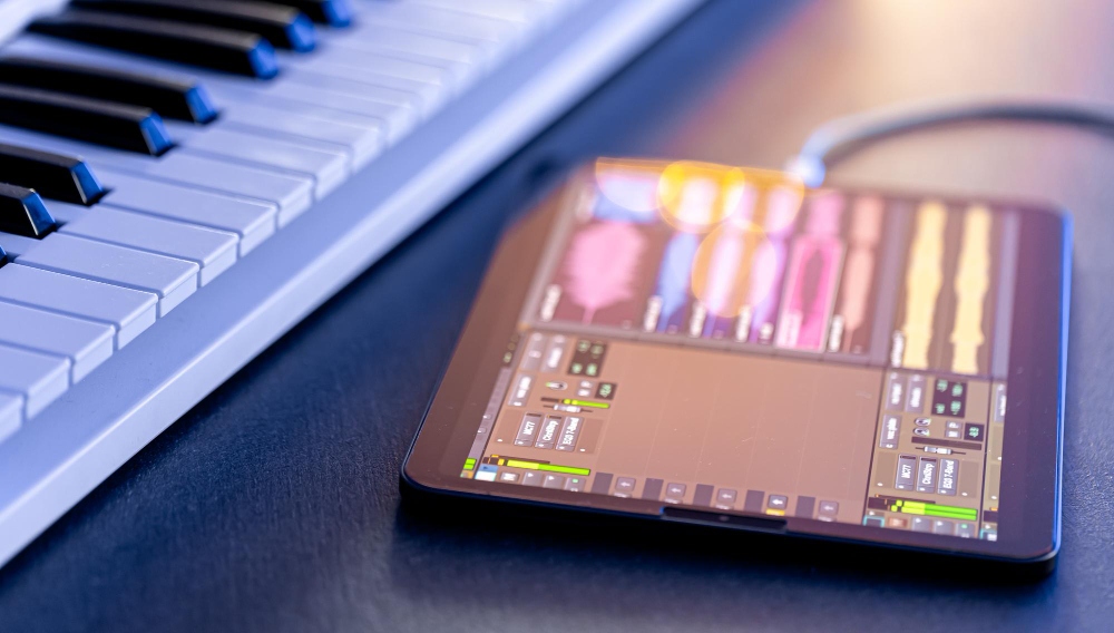 ai music transcription software on a tablet with a keyboard