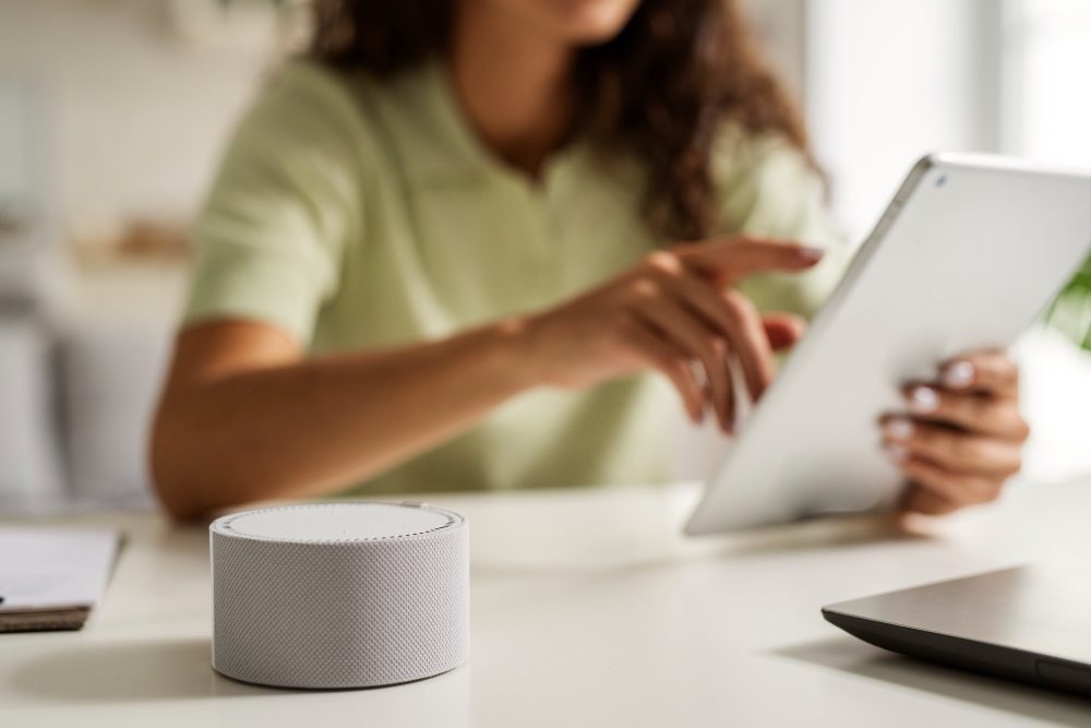  woman on tablet choosing between gemini and google assistant