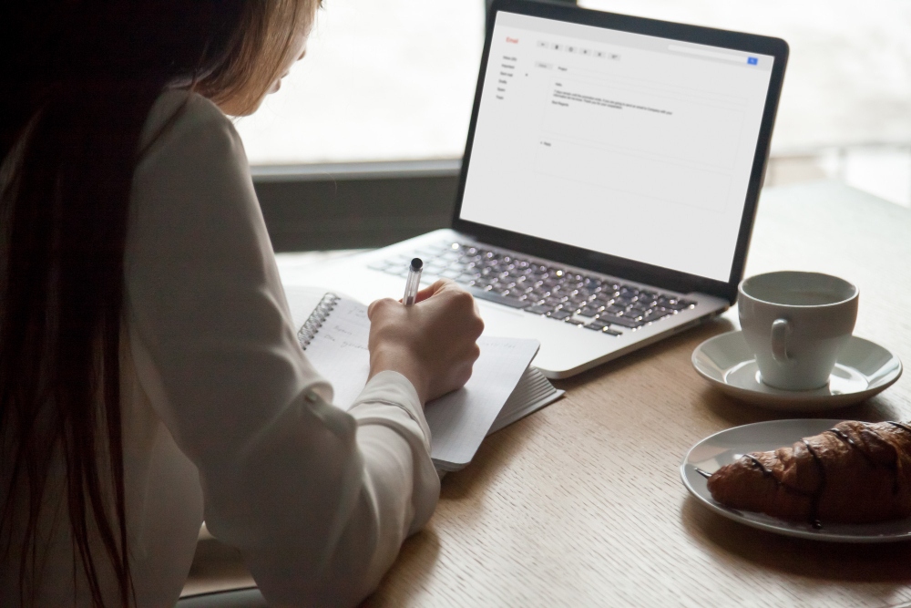 entrepreneur taking notes and summarizing emails