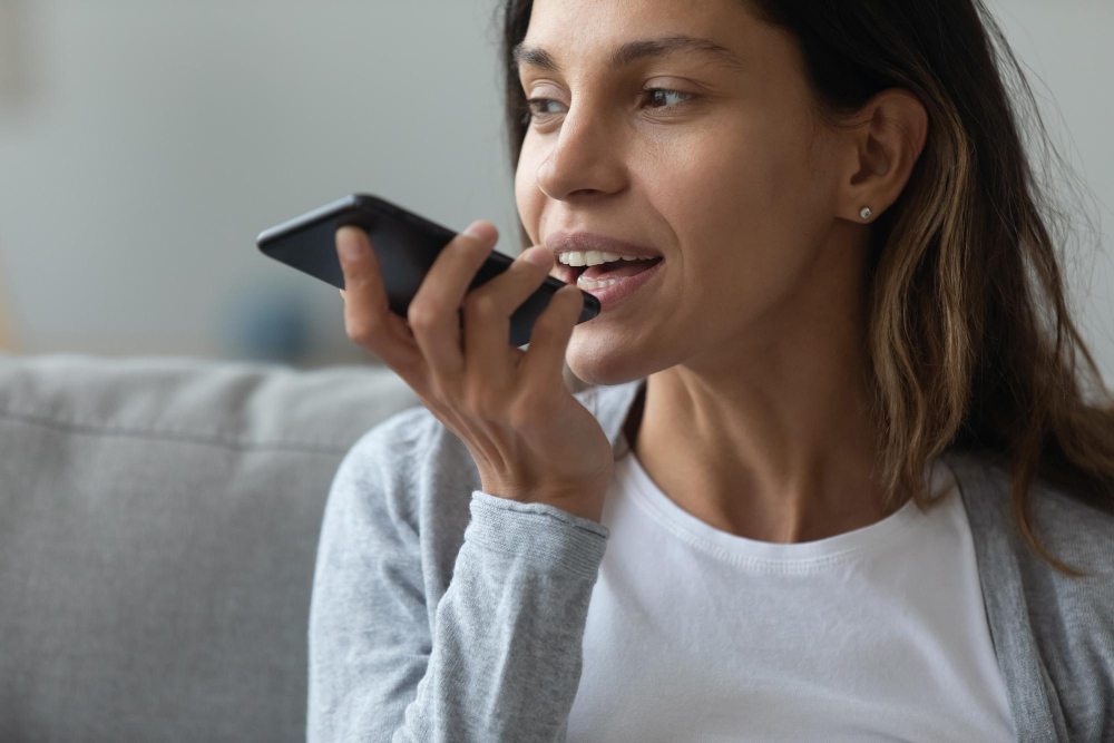Girl recording voicemail greeting