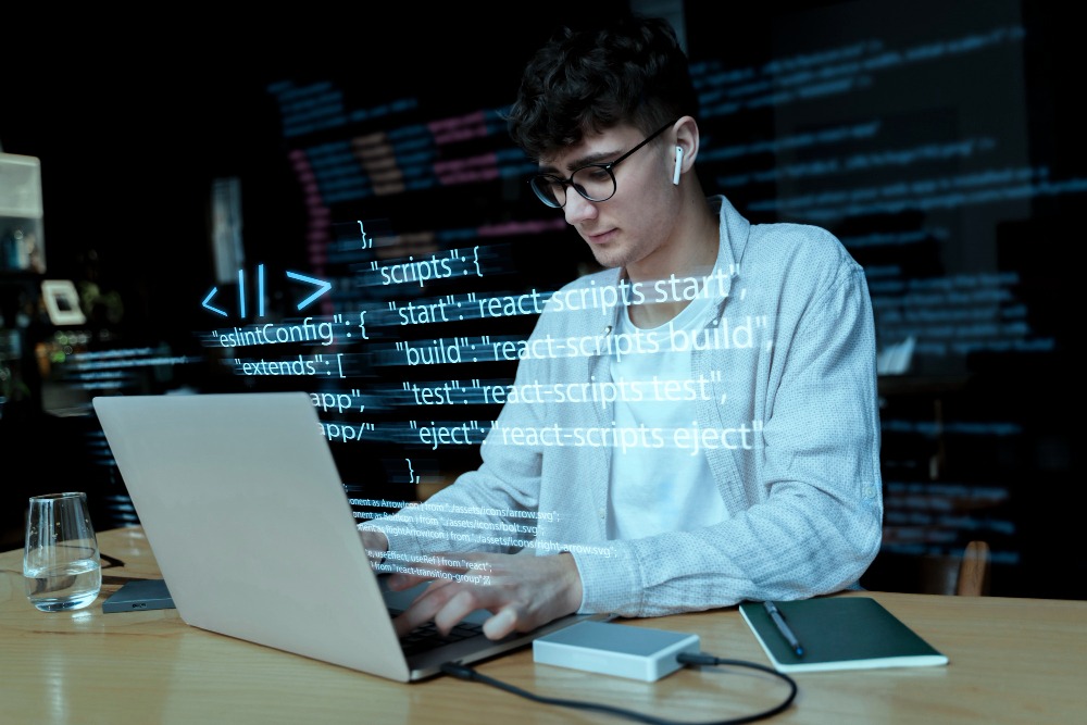 developer on laptop vibe coding an app