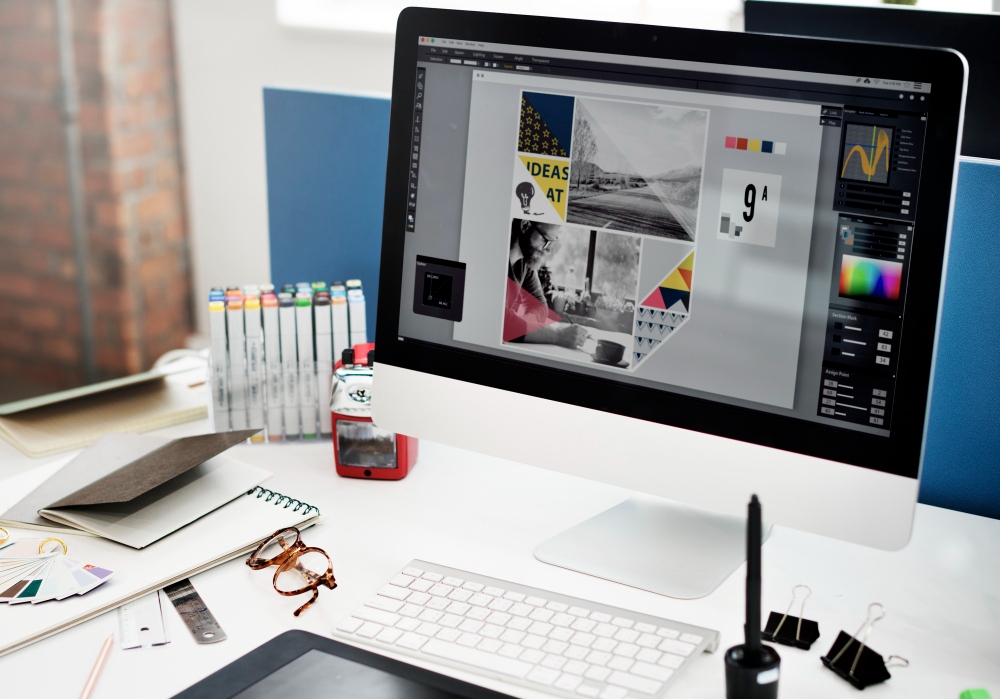 freelance graphic designer creating marketing assets in software