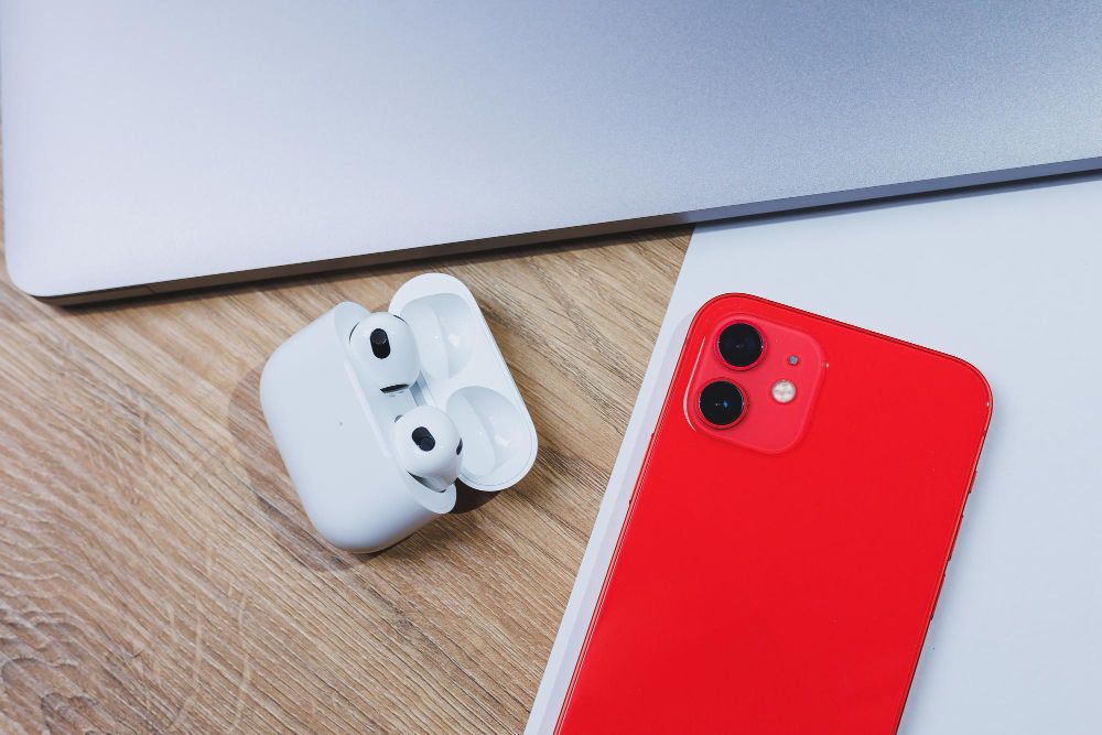 person pairing airpods with iphone