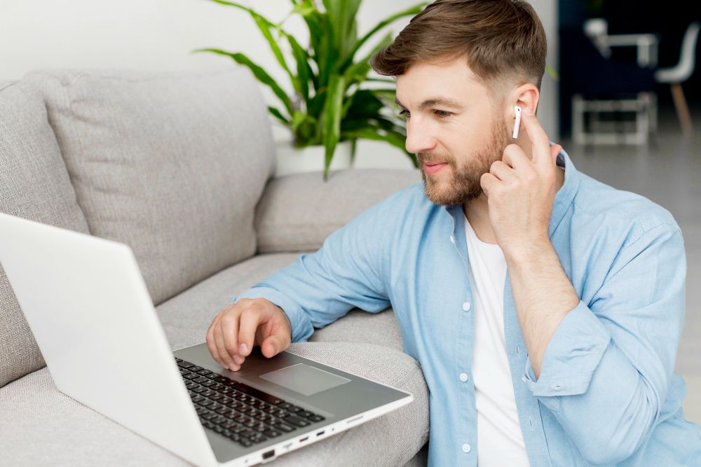 person pairing airpods with windows