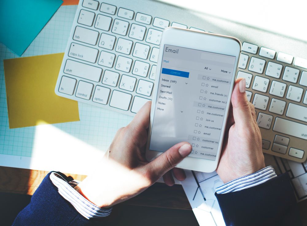 person saving email pdf on phone