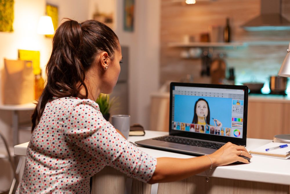 person editing a photo on laptop