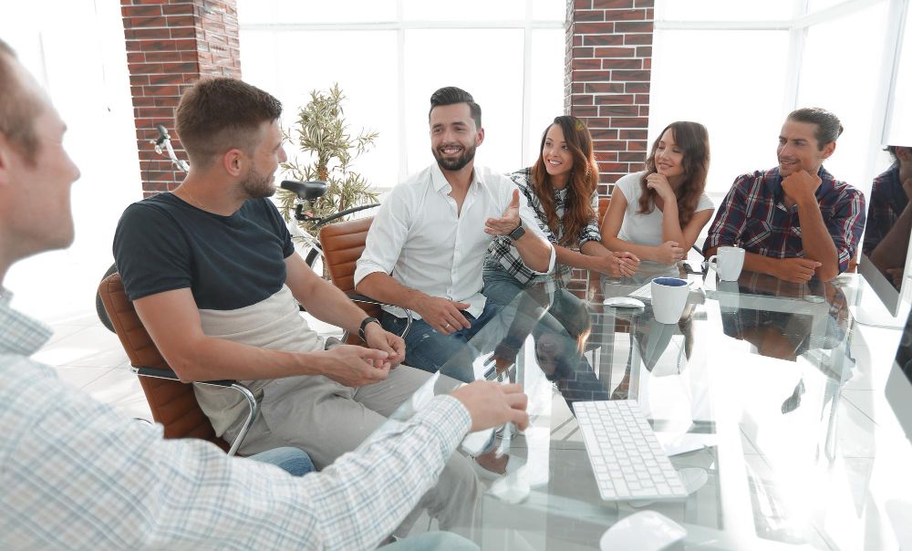 coworkers discussing ideas around a conference table