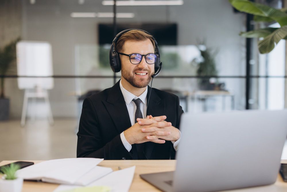 professional attending an online meeting with headset