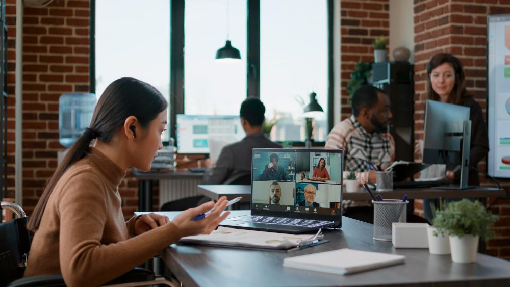 professional joining a hybrid video meeting