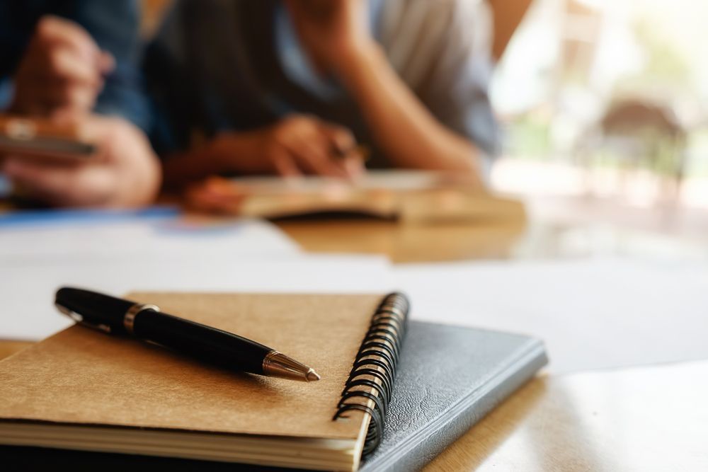 notebook and pen for meeting notes
