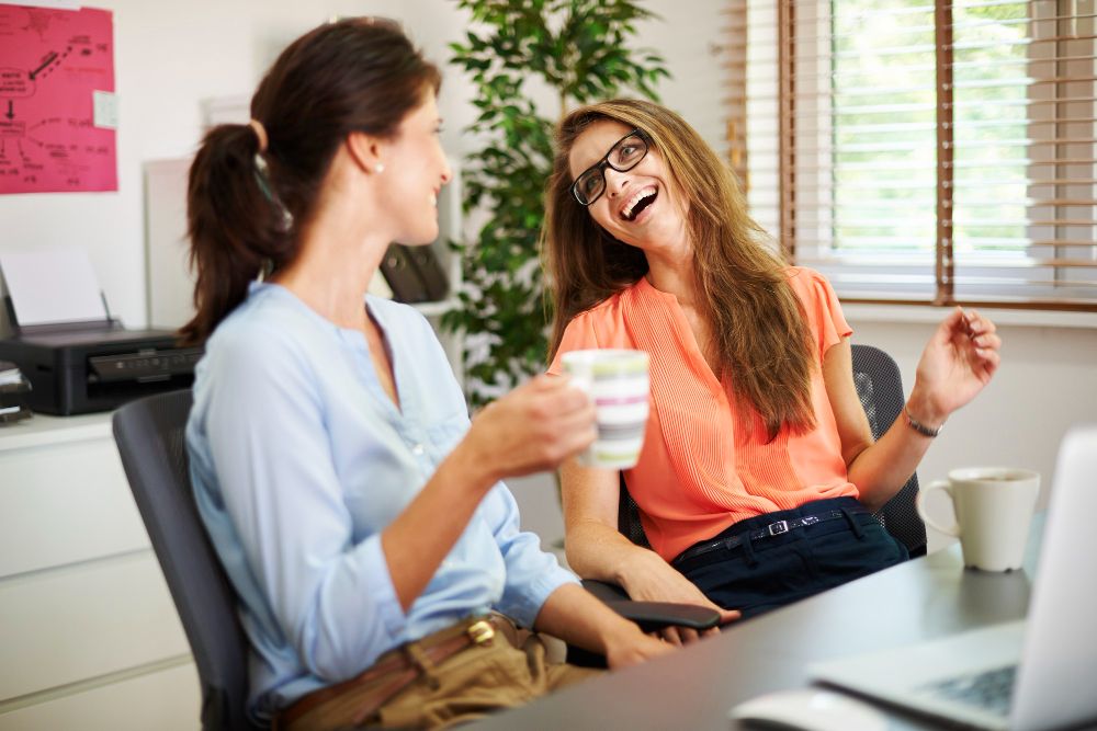 coworkers having an informal office discussion