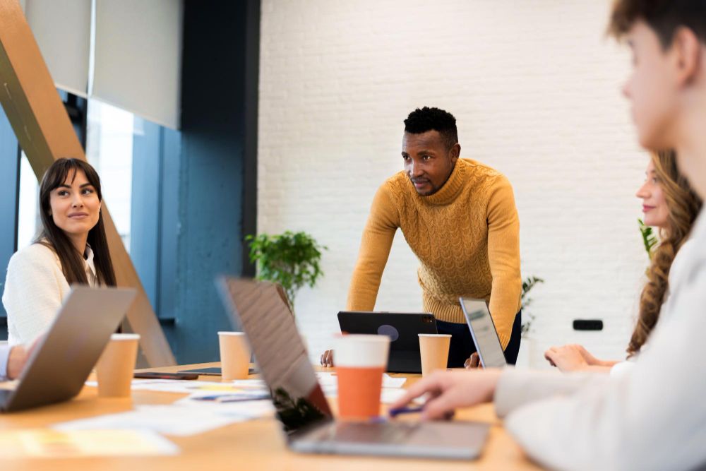 coworkers discussing ideas in a team meeting
