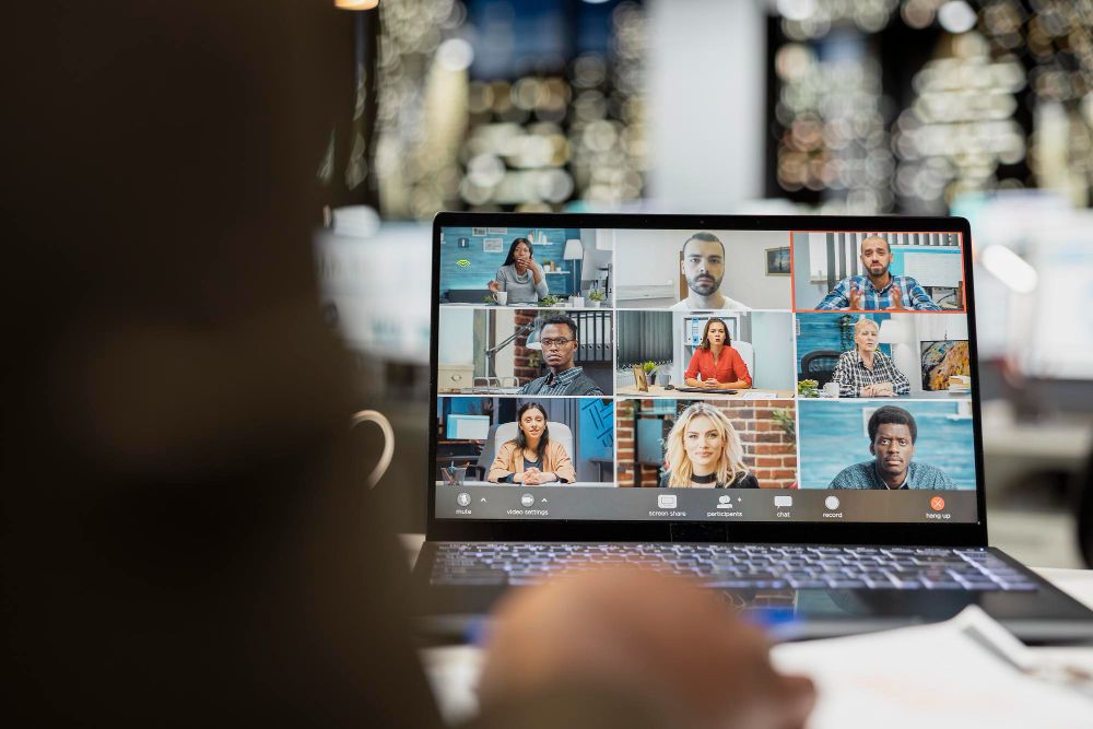 remote team meeting on laptop screen