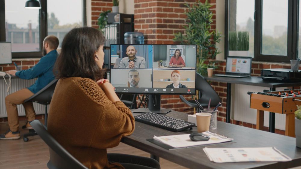 professional attending a video meeting on desktop